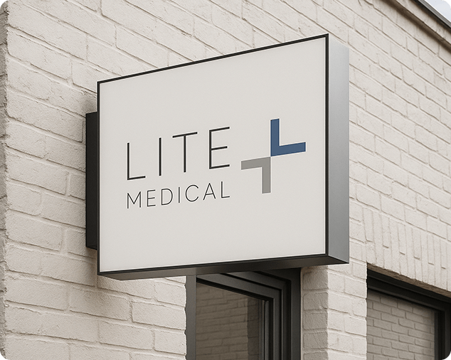 Exterior of a white brick medical building in Edina, Minnesota, featuring the Lite Medical sign and a modern, professional clinic facade.