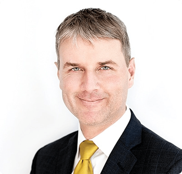 Professional headshot of smiling doctor at Lite Medical Clinic.