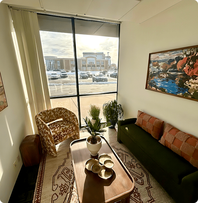 Cozy waiting area inside Lite Medical Clinic in Eden Prairie, Minnesota, featuring comfortable seating, modern artwork, natural light, and a calm, welcoming atmosphere.