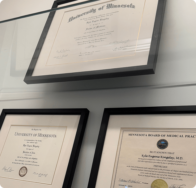 Framed medical degree and professional certifications displayed at Lite Medical, highlighting physician credentials and medical licensure.