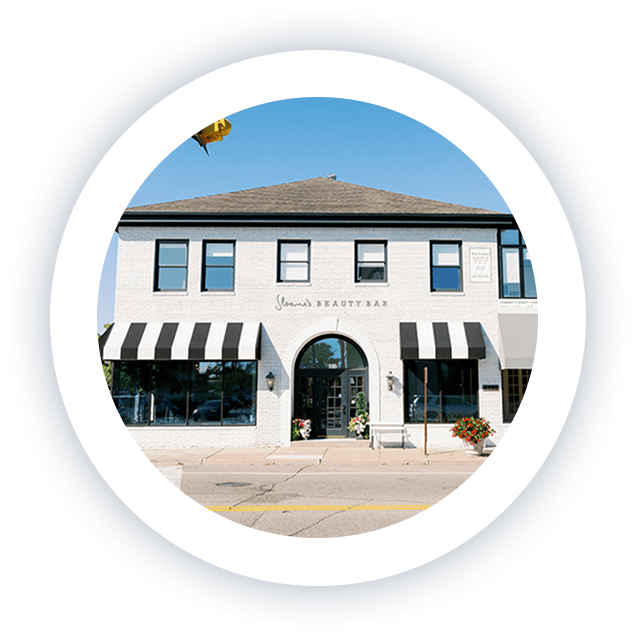 Exterior view of a modern two-story building at 4388 France Ave S, home to Lite Medical in Edina, Minnesota. Storefronts with white brick, black awnings, and large street-facing windows.