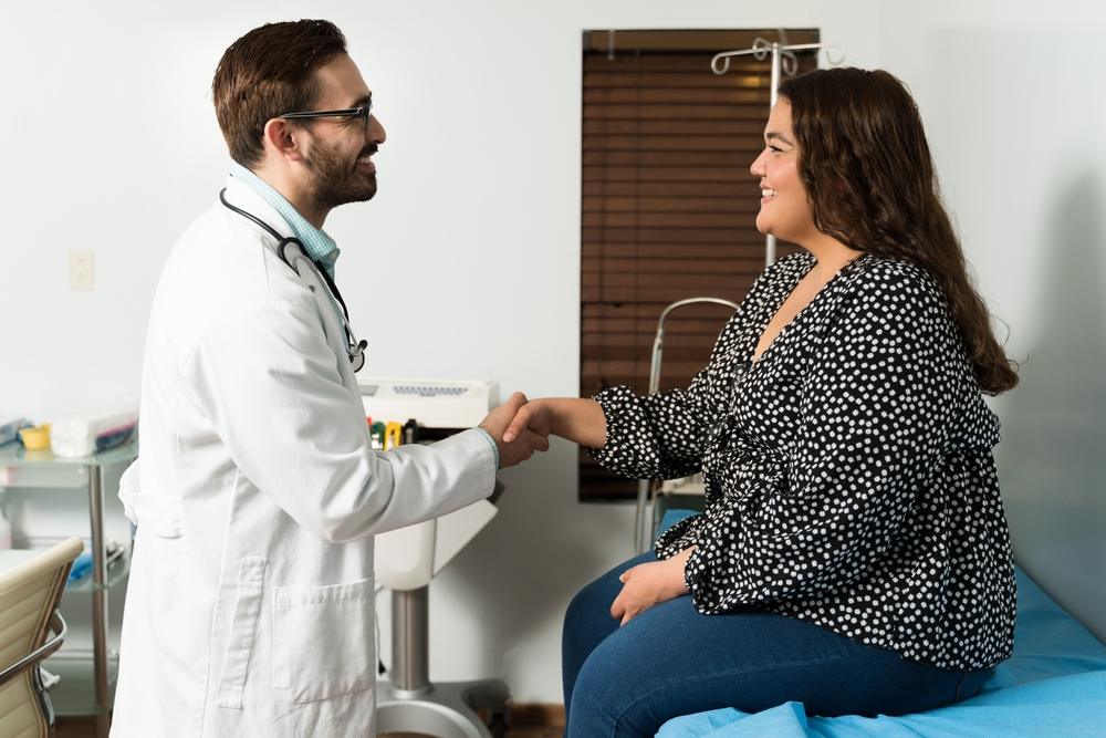 Physician reviewing metabolic laboratory results and discussing tirzepatide weight management plan with adult patient in Blaine clinic